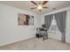 Spacious bedroom with a standing desk and large window at 6251 S Moccasin Trl, Gilbert, AZ 85298