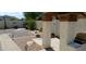 Landscaped backyard with pergola and sitting area at 6251 S Moccasin Trl, Gilbert, AZ 85298
