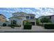Two-story house with blue accents and landscaped front yard at 6251 S Moccasin Trl, Gilbert, AZ 85298