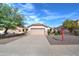 Single story home with 2 car garage and landscaped yard at 3128 E Millbrae Ln, Gilbert, AZ 85234