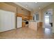 Well-equipped kitchen featuring an island and access to the backyard at 3128 E Millbrae Ln, Gilbert, AZ 85234