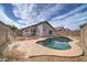 Enjoy this kidney shaped pool with surrounding patio at 3128 E Millbrae Ln, Gilbert, AZ 85234