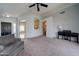 Open living room with a view into the kitchen and entryway at 3128 E Millbrae Ln, Gilbert, AZ 85234