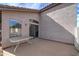 Relaxing backyard patio with table and access to the home at 3128 E Millbrae Ln, Gilbert, AZ 85234