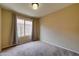 Bright bedroom with carpet and window coverings at 3128 E Millbrae Ln, Gilbert, AZ 85234