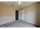 Bedroom with double door closet and carpet at 3128 E Millbrae Ln, Gilbert, AZ 85234