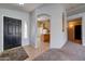 Inviting entryway with tiled flooring and view into the kitchen at 3128 E Millbrae Ln, Gilbert, AZ 85234