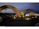 Community entrance with modern archways and landscaping at 8425 S 10Th Ln # 1, Phoenix, AZ 85041
