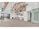 Open living room and kitchen with high ceilings and wood beams at 8425 S 10Th Ln # 1, Phoenix, AZ 85041