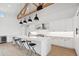 Modern kitchen with white cabinetry and large island at 8425 S 10Th Ln # 1, Phoenix, AZ 85041