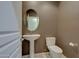 Clean bathroom with pedestal sink and toilet at 32099 N 73Rd Pl, Scottsdale, AZ 85266