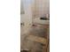 Bathroom with a tub and damaged floor needing repair at 3840 N 43Rd Ave # 71, Phoenix, AZ 85031