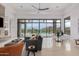 Bright living room featuring floor-to-ceiling windows, modern furniture, and mountain views at 15332 E Hidden Springs Trl, Fountain Hills, AZ 85268