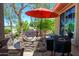 Outdoor patio with built-in grill, umbrella, and seating area at 17226 W Calistoga Dr, Surprise, AZ 85387