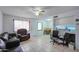 Living room with leather sofas, and a view into the kitchen and dining area at 6842 W Devonshire Ave, Phoenix, AZ 85033