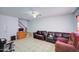 Living room with two sofas, a tiled floor and stairs leading upstairs at 6842 W Devonshire Ave, Phoenix, AZ 85033