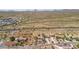 Aerial view of homes nestled in a desert landscape with mountains in the background at 2825 W Pinto Pl, Wickenburg, AZ 85390