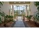 Pathway to entry gate, framed by lush plants at 10512 E Cortez Dr, Scottsdale, AZ 85259