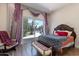 Bedroom with pool view, sliding door, and plush bedding at 10512 E Cortez Dr, Scottsdale, AZ 85259