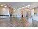 Bright living room with hardwood floors, stone fireplace, and high ceilings at 10512 E Cortez Dr, Scottsdale, AZ 85259