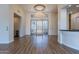 Bright foyer with hardwood floors and a grand chandelier at 10512 E Cortez Dr, Scottsdale, AZ 85259