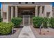 Elegant entry gate with ornate design and lush greenery at 10512 E Cortez Dr, Scottsdale, AZ 85259