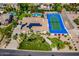 Aerial view of luxury home with pool, sports court, and lush landscaping at 10512 E Cortez Dr, Scottsdale, AZ 85259