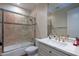 Clean bathroom with a bathtub, shower, and updated vanity at 10512 E Cortez Dr, Scottsdale, AZ 85259