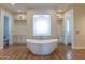 Spa-like bathroom with a large soaking tub and modern finishes at 10512 E Cortez Dr, Scottsdale, AZ 85259