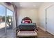 Bedroom with pool view, sliding door and bench at foot of bed at 10512 E Cortez Dr, Scottsdale, AZ 85259