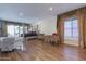 Spacious bedroom with hardwood floors, large windows, and a view of the backyard at 10512 E Cortez Dr, Scottsdale, AZ 85259