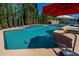 Relaxing rectangular pool with decorative tile and patio furniture at 10512 E Cortez Dr, Scottsdale, AZ 85259