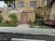 Neatly landscaped front yard with a wooden gate at 4255 N 67Th Ln, Phoenix, AZ 85033