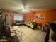 Comfortable living room with orange walls and sectional sofa at 4255 N 67Th Ln, Phoenix, AZ 85033