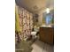 Bathroom with shower/tub combo and wood vanity at 4255 N 67Th Ln, Phoenix, AZ 85033