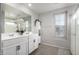 Bathroom with double vanity and a large shower at 16256 W La Ventilla Way, Goodyear, AZ 85338