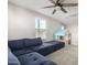 Bright playroom featuring a sectional sofa and playhouse at 16256 W La Ventilla Way, Goodyear, AZ 85338