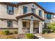 Two-story house with covered porch and a bench at 16256 W La Ventilla Way, Goodyear, AZ 85338