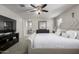 Spacious main bedroom with king bed and ensuite bathroom at 16256 W La Ventilla Way, Goodyear, AZ 85338