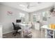 Home office with a desk, chair, and plenty of storage at 16256 W La Ventilla Way, Goodyear, AZ 85338