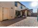 Spacious backyard patio with seating area and brick pavers at 16256 W La Ventilla Way, Goodyear, AZ 85338