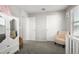 Bright bedroom with ample closet space and a cozy armchair at 16256 W La Ventilla Way, Goodyear, AZ 85338