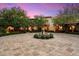 Elegant courtyard with a fountain and beautiful landscaping at 10719 E Rimrock Dr, Scottsdale, AZ 85255