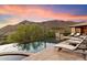 Infinity pool and spa with expansive mountain views at 10719 E Rimrock Dr, Scottsdale, AZ 85255