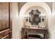 Powder room with ornate vanity and decorative mirror at 10719 E Rimrock Dr, Scottsdale, AZ 85255