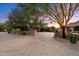 Elegant home exterior with stone accents and landscaping at 10719 E Rimrock Dr, Scottsdale, AZ 85255
