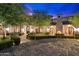 Home exterior with courtyard and stone pathway at 10719 E Rimrock Dr, Scottsdale, AZ 85255