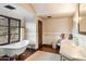 Luxurious bathroom with freestanding tub and marble vanity at 10719 E Rimrock Dr, Scottsdale, AZ 85255