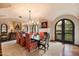 Formal dining room with hardwood floors, fireplace and French doors at 10719 E Rimrock Dr, Scottsdale, AZ 85255