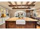 Spacious kitchen with a large island, farmhouse sink, and custom cabinetry at 10719 E Rimrock Dr, Scottsdale, AZ 85255